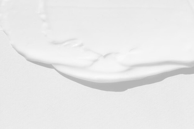 Large smears of white cosmetic cream The texture of the cream closeup