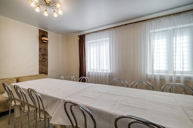 Large table with chairs in the banquet hall