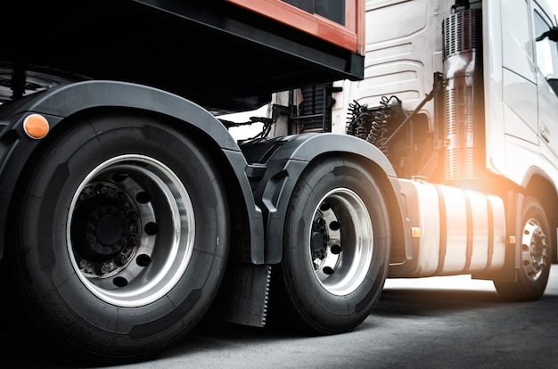 Large a truck wheels of semi truck. Road freight cargo shipment.