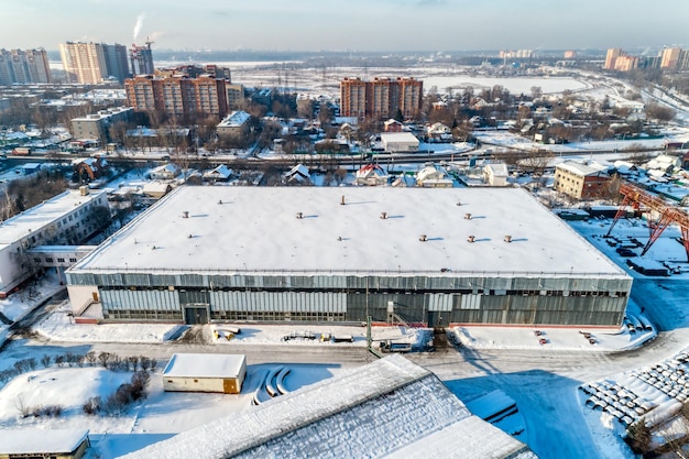 Large warehouse hangar industrial zone of the city Sunny winter day