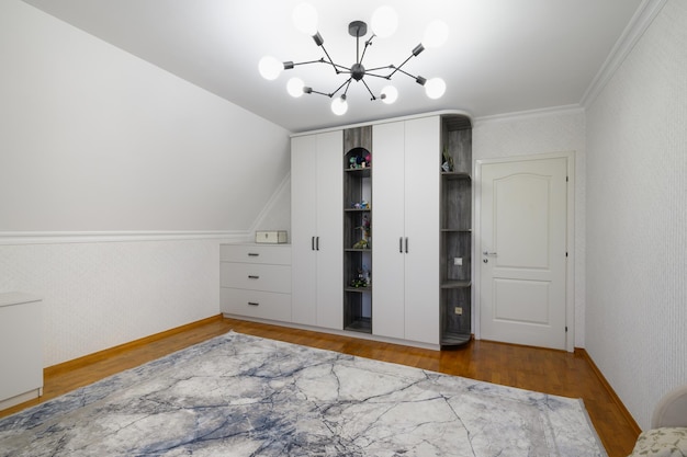 Large white cabinet in living room with wooden floor