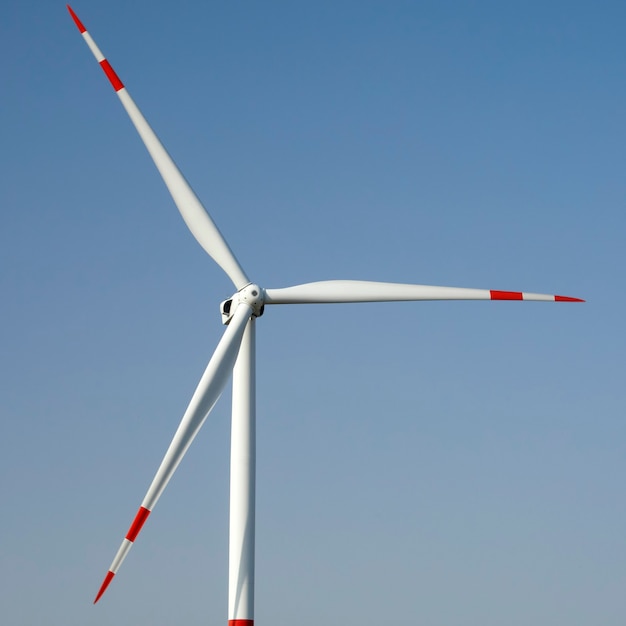 Large wind turbine against blue sky