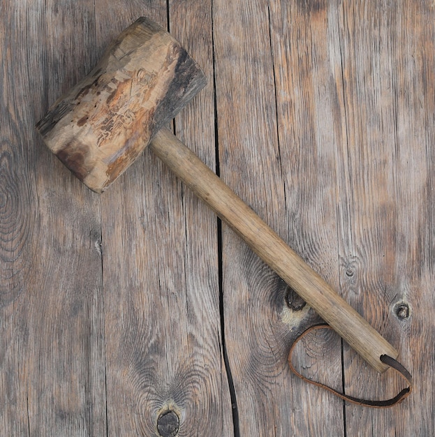 A large wooden hammer with the word hammer on it