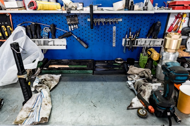 Large workbench with tools at station for vehicle technical servicing