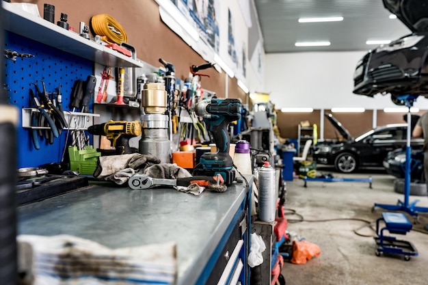 Large workbench with tools at station for vehicle technical servicing