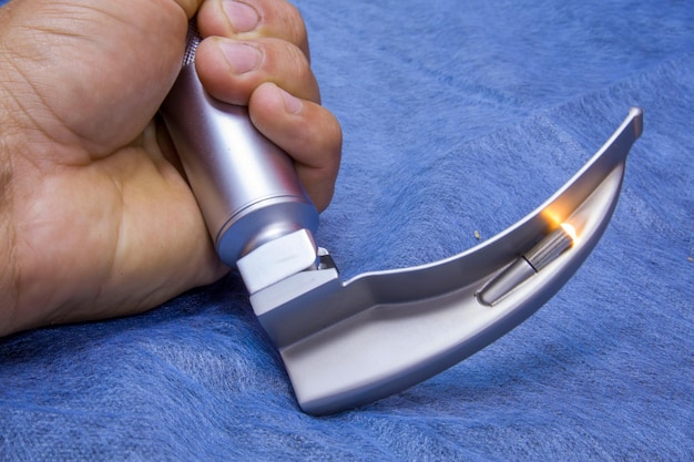 Laryngoscope for intubation on a blue medical cloth