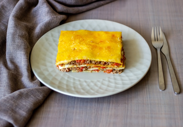 Lasagna on a gray surface Italian cuisine