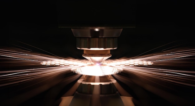 Laser cutting of metal sheet in production closeup