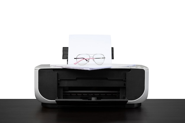 Laser home printer on table against white backgorund