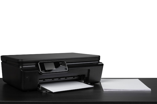 Laser home printer on table against white backgorund