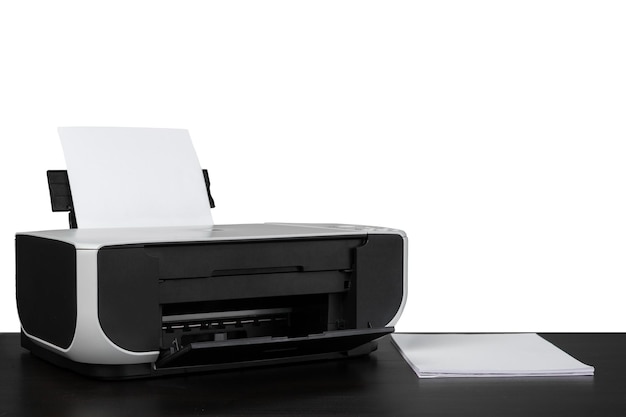 Laser home printer on table against white backgorund