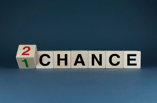 Photo last chance cubes form the words first chance and second last chance concept image