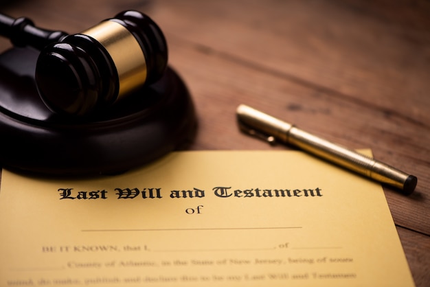 Last will and testament form with gavel. Decision, financial close up