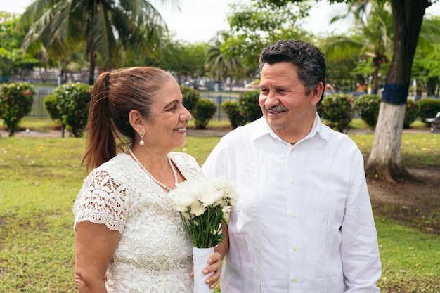 Latin bride and groom getting married in the garden