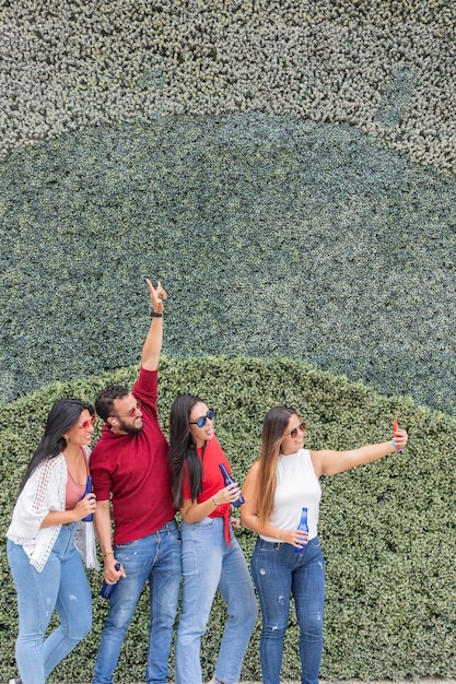 Latin friends taking a selfie in the open air