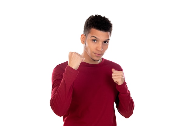 Latin guy with short afro hair isolated on white wall