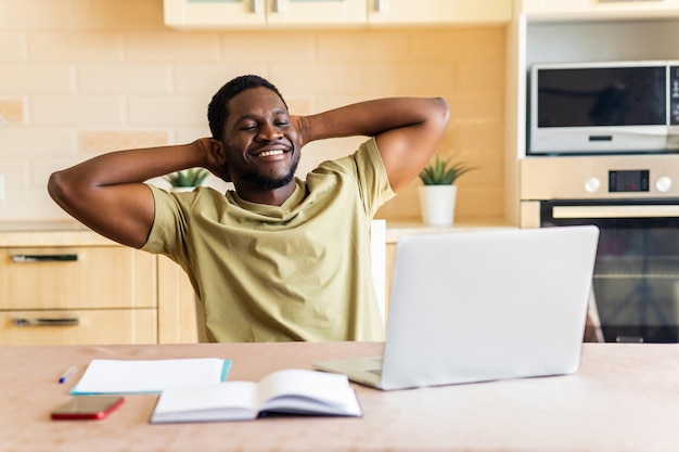 Latin hispanic man freelancer using laptop studying online working from home