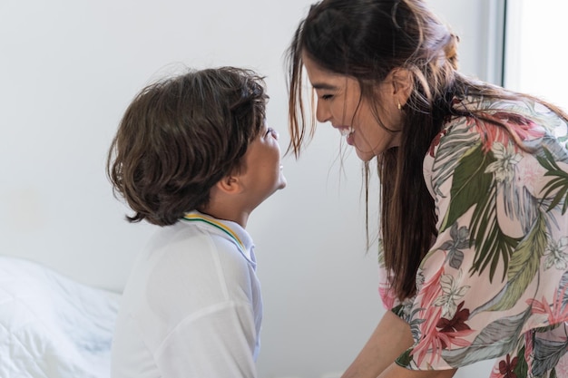 Latin mother getting son ready for school