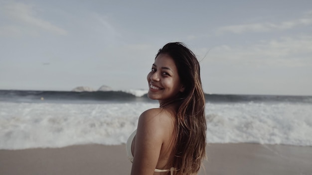 Latin young girl famous beach Rio de Janeiro Brazil Latin summer vacation holiday