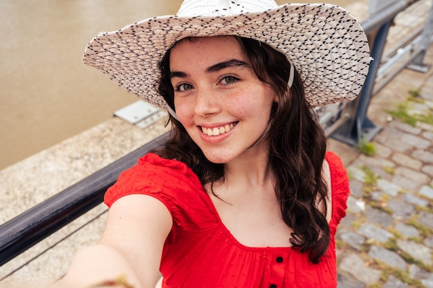 Latina Teen Woman Taking a Selfie. Concept socialmedia.