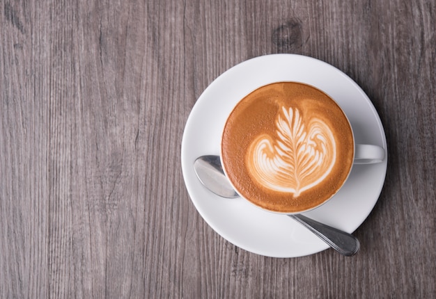 latte or Cappuccino, coffee cup top view on table in cafe