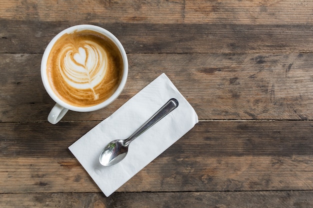 latte coffee cup on wooden table