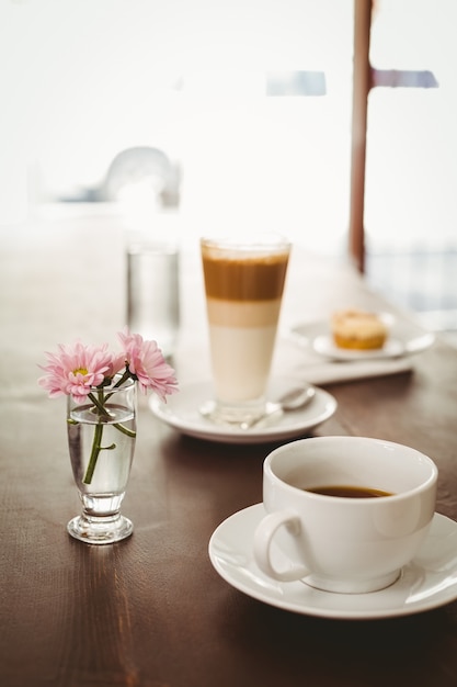 Latte and coffee on table