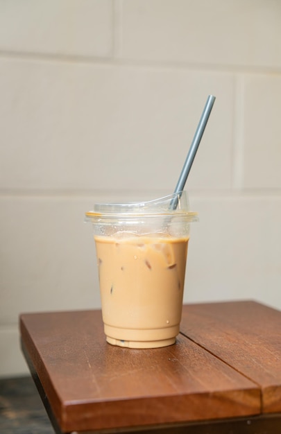 latte coffee in take away glass wood on table