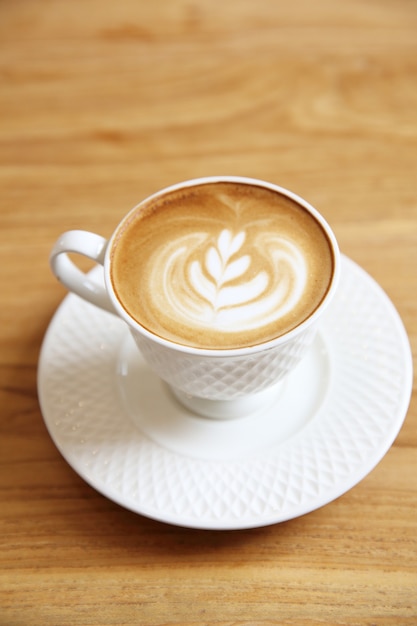 Latte coffee on wood background