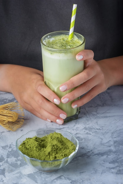 Latte made from matcha green tea and soy milk close-up. Vegetarian drink