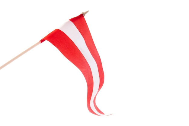 The latvian flag on a white background is developing and flying in the wind