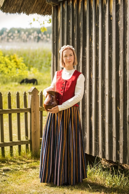 Latvian woman in traditional clothing. Ligo folk.