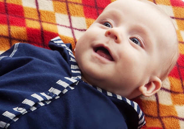 Laughing baby boy happy day home