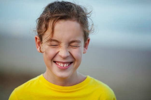 Laughing child with eyes closed tight