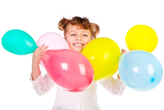 Laughing girl with color balloons