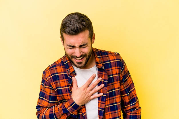 Laughing keeping hands on heart concept of happiness