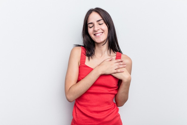 Laughing keeping hands on heart concept of happiness