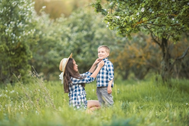 A Laughing kids brother and sister playing in a forest