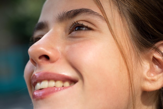 Laughing woman Portrait of happy smiling girl Cheerful young beautiful girl smiling laughing outdoor Emotions on face close up