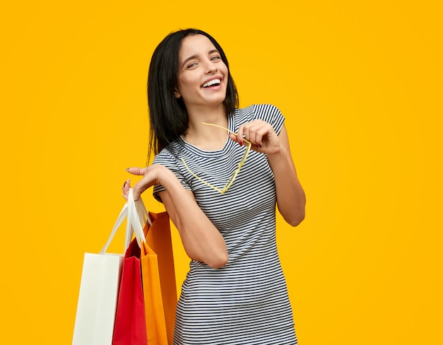 Laughing woman with paper bags