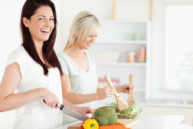 Laughing Women preparing dinner