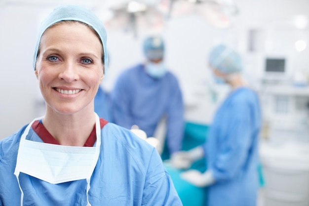 Laughter and happiness are the best medicine Portrait of a mature female doctor smiling in an operating room