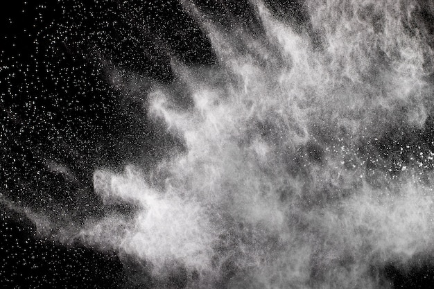 Photo . launched white particle splash on black background