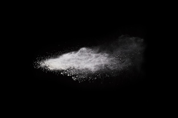 Launched white powder, isolated on black background.