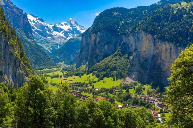 Lauterbrunnen valley, village of Lauterbrunnen, waterfalls and the Lauterbrunnen Wall in Swiss Alps, Switzerland.