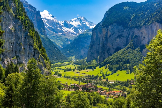 Lauterbrunnen valley, village of Lauterbrunnen, waterfalls and the Lauterbrunnen Wall in Swiss Alps, Switzerland.