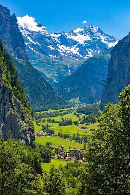 Lauterbrunnen valley, village of Lauterbrunnen, waterfalls and the Lauterbrunnen Wall in Swiss Alps, Switzerland.