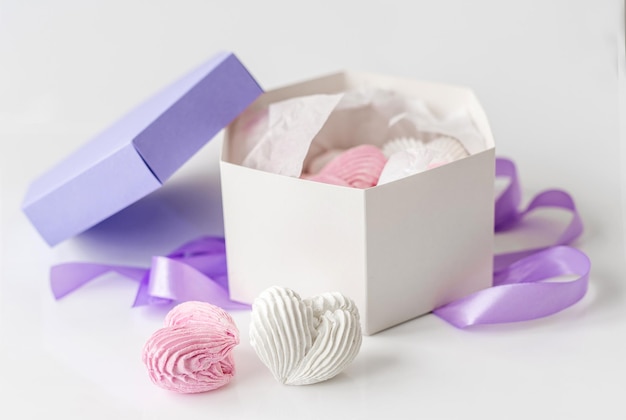 Lavander box with sweet homemade marshmallow pink and white color isolated on white background Gift package with set of craft heart shape sweets desert