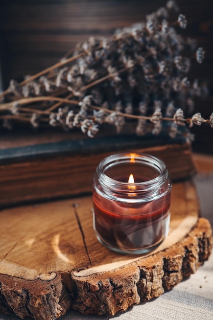 Lavender and candles on a old wooden background