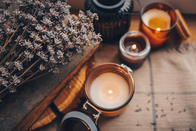 Lavender and candles on a old wooden background